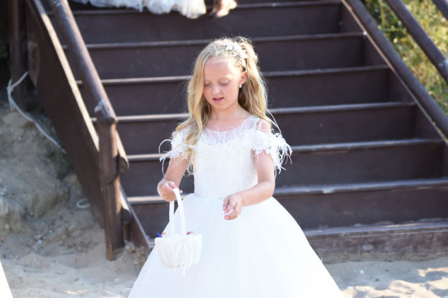 Brides maid dropping flowers