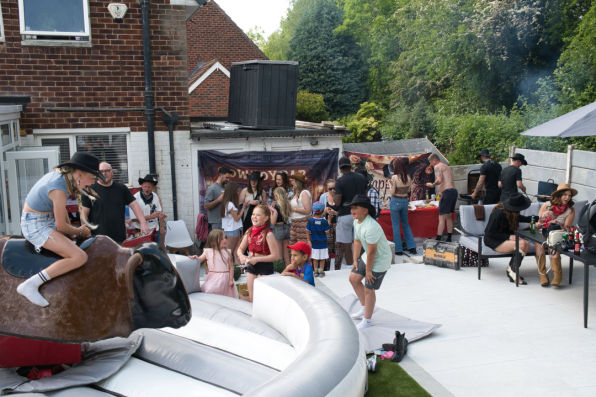 Group of people hat a cowboy theme birthday party 